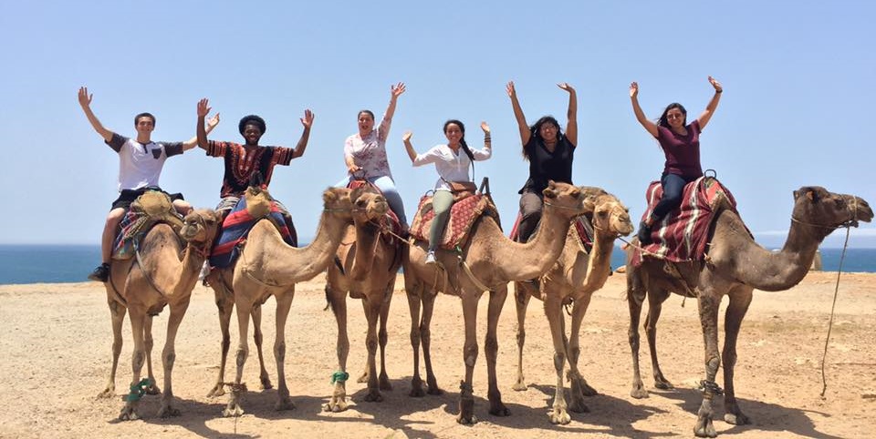First Gen Abroad students on camels on the beach in Morocco
