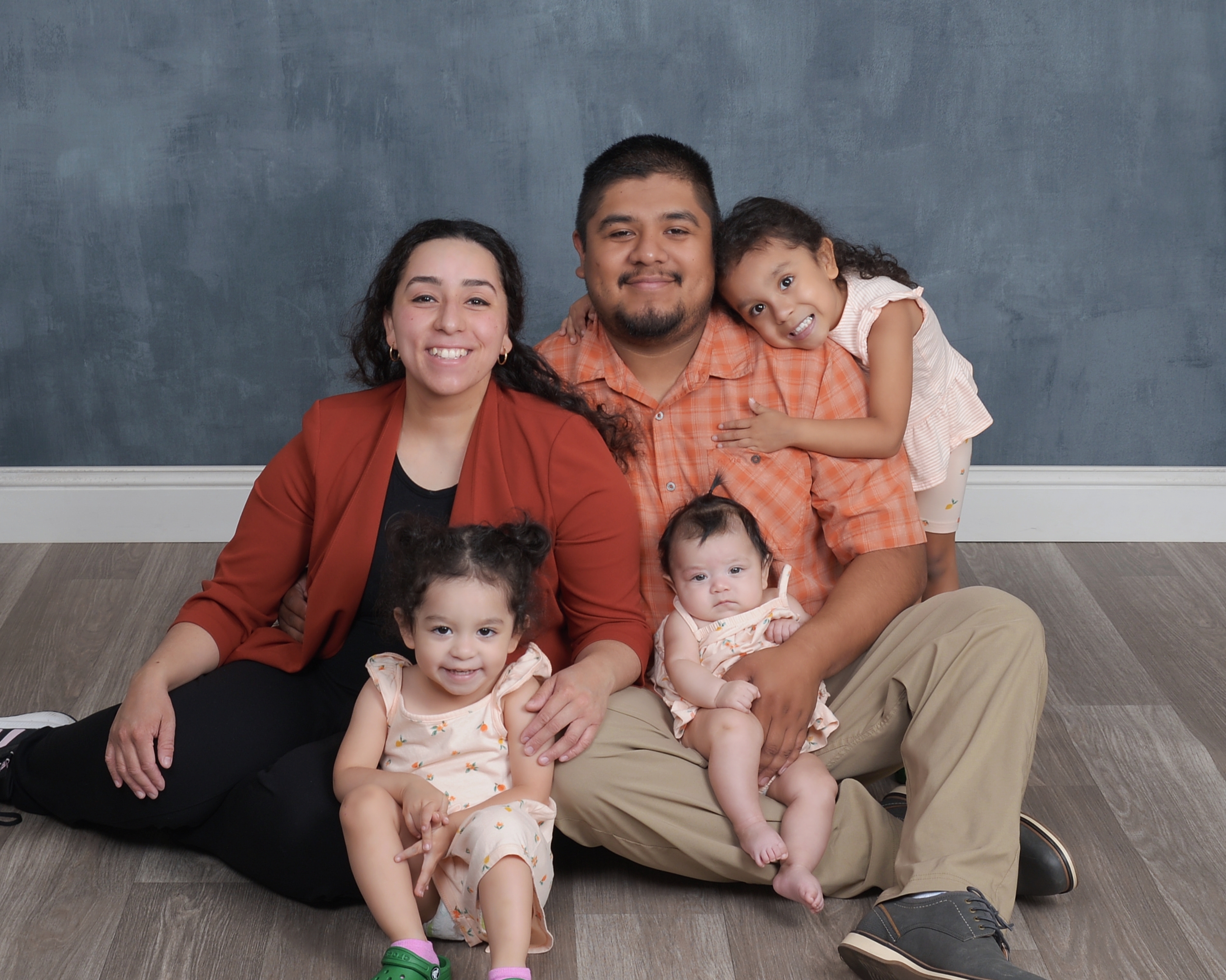 Alejandra Carranza (left) with her partner Ramiro and daughters Leonila (hugging Ramiro), Aislinn, and baby Eowyn. Student Support Services staff helped coach Alejandra when she was in labor with Leonila.